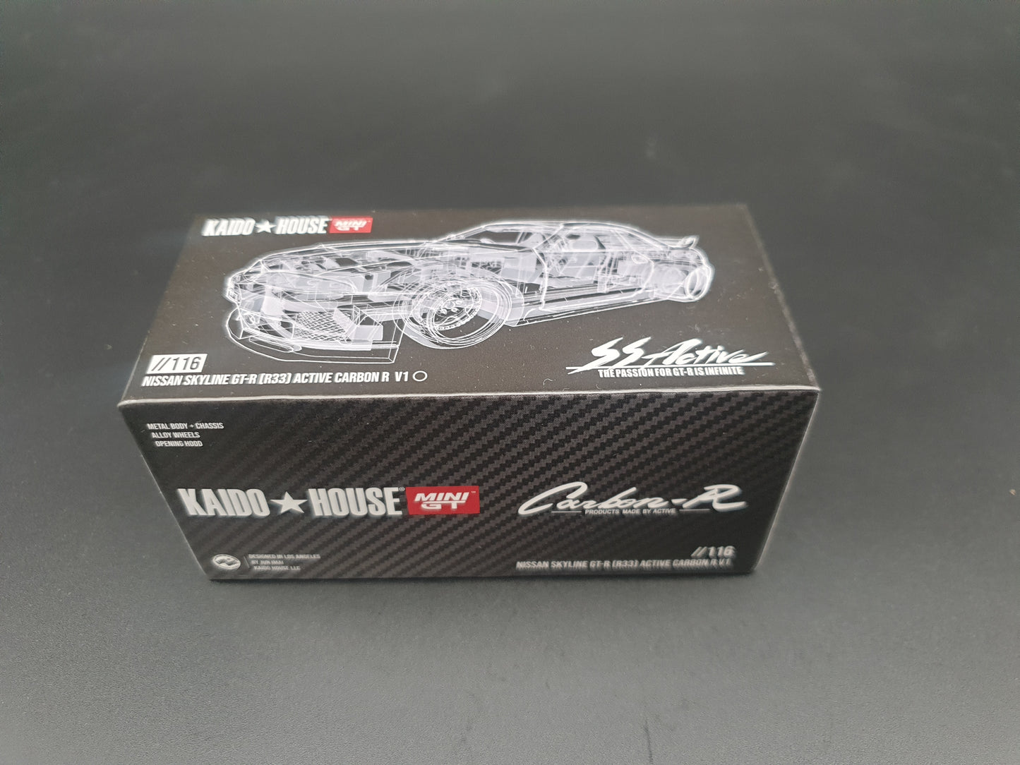 Nissan Skyline GT-R R33 Active Carbon R V1 KAIDO HOUSE Mini GT 1:64